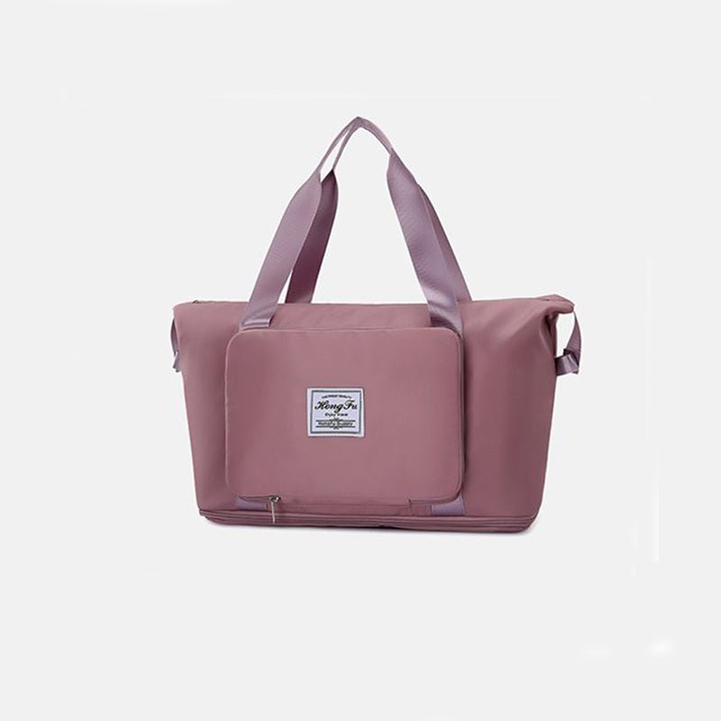 Travel Gym Bag in pink, foldable and waterproof with large capacity for gym and travel purposes.